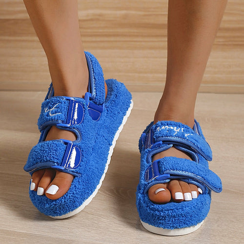 Blue thick-soled women’s sandals, fuzzy upper with two Velcro straps and open toe