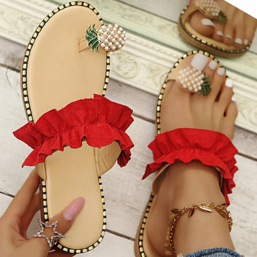 Pineapple pearl slippers with red ruffle straps, flat toe slides and decorative pineapple piece