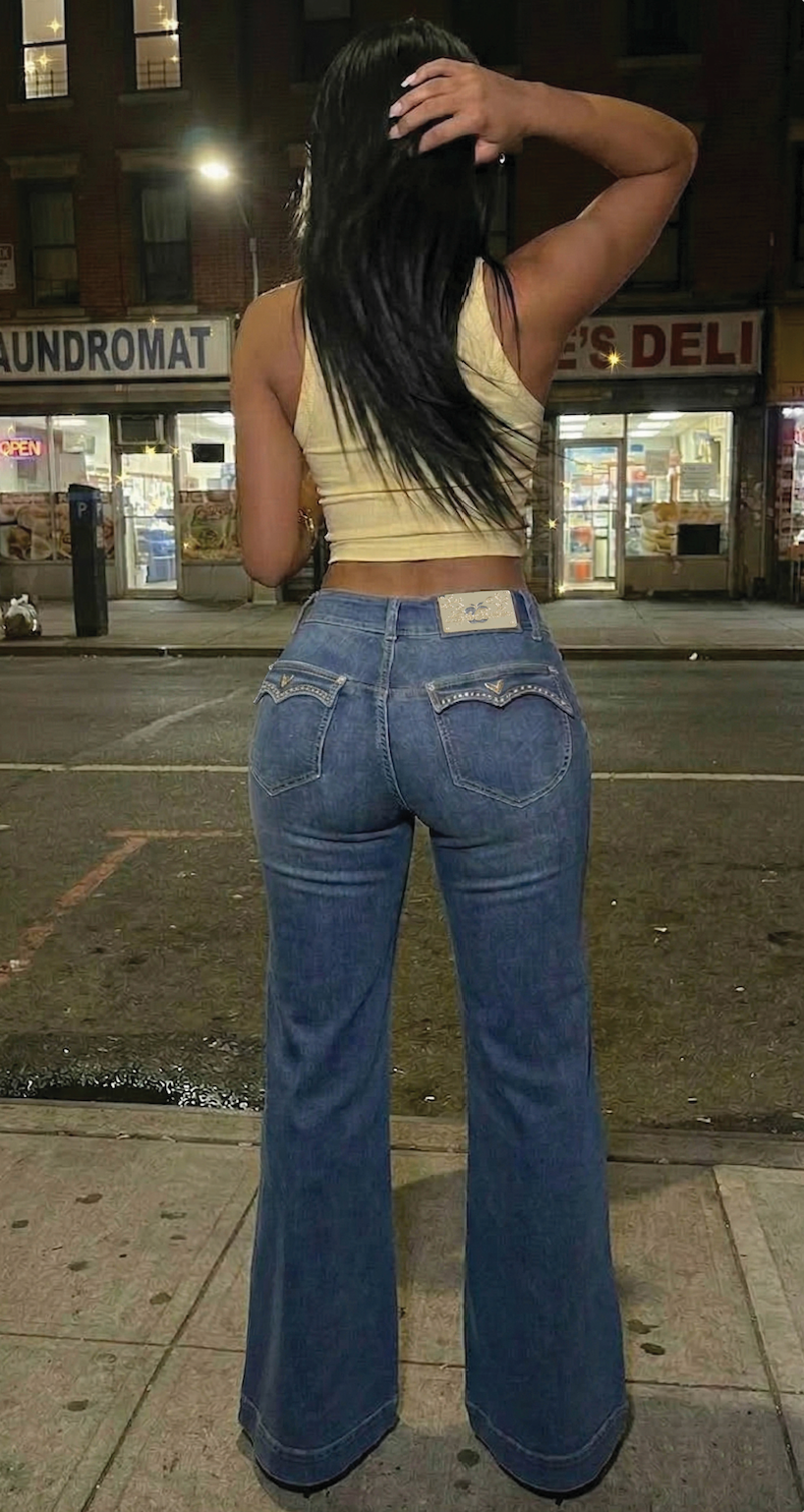 Wide-leg jeans with high waist, dark blue wash, and contrast-stitched back pocket design