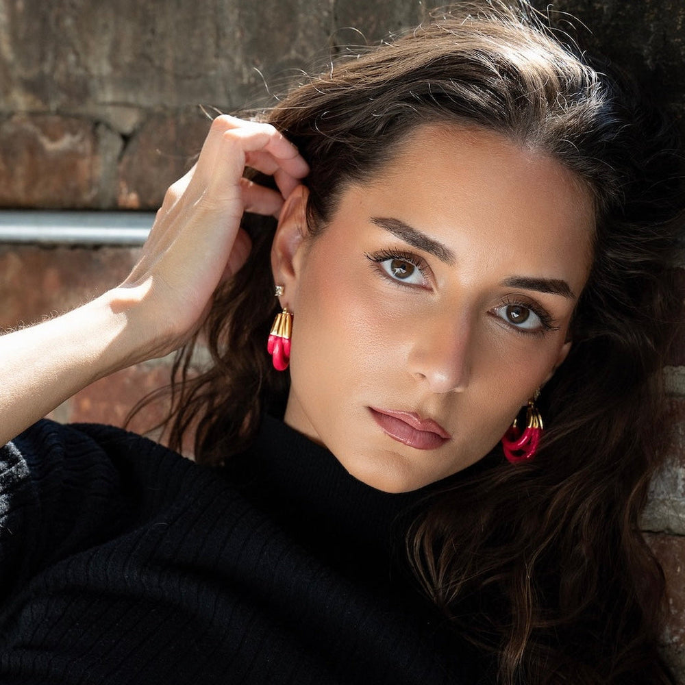 Triple hoop lucite earrings in Pink Flamingo on model, gold hoops with layered look