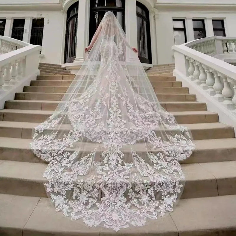 Long bridal tulle veil with lace and sequined floral border, comb at the crown