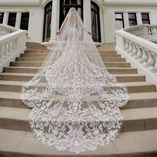 Long bridal tulle veil with lace and sequined floral border, comb at the crown