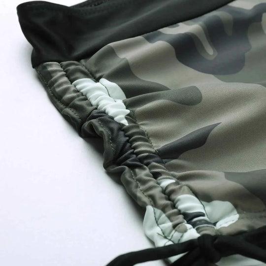Camo bikini shorts close-up with ruched drawstring waistband and black tie