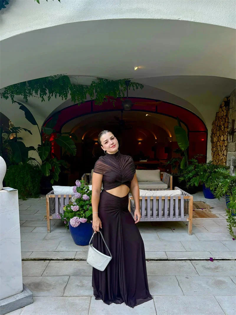 Black high-waist maxi dress, short sleeves, twisted front and midriff cutout