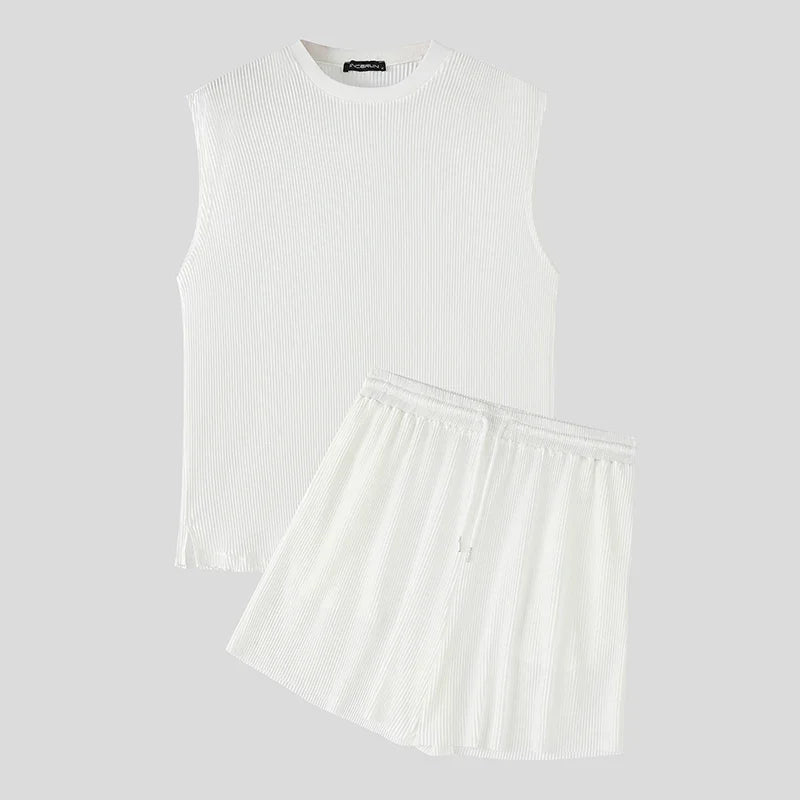 White ribbed sleeveless tank and pleated shorts set, matching men’s set