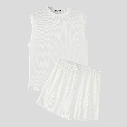White ribbed sleeveless tank and pleated shorts set, matching men’s set