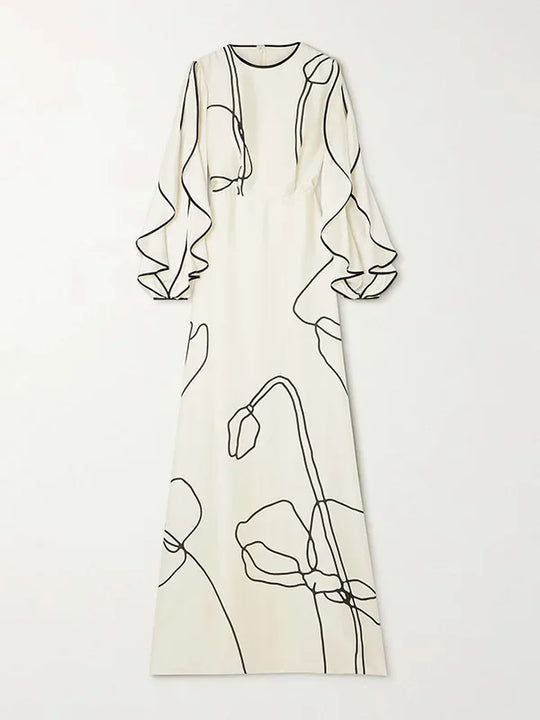 White evening dress with black floral line print, long sleeves and straight cut