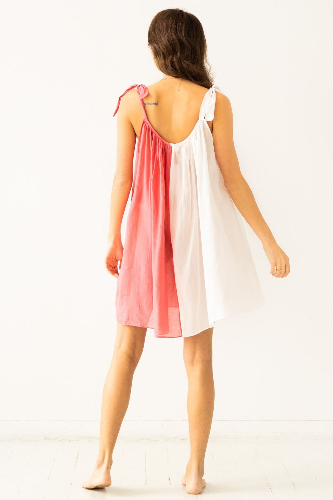 Back view sheer babydoll with tie straps, white and geranium panels