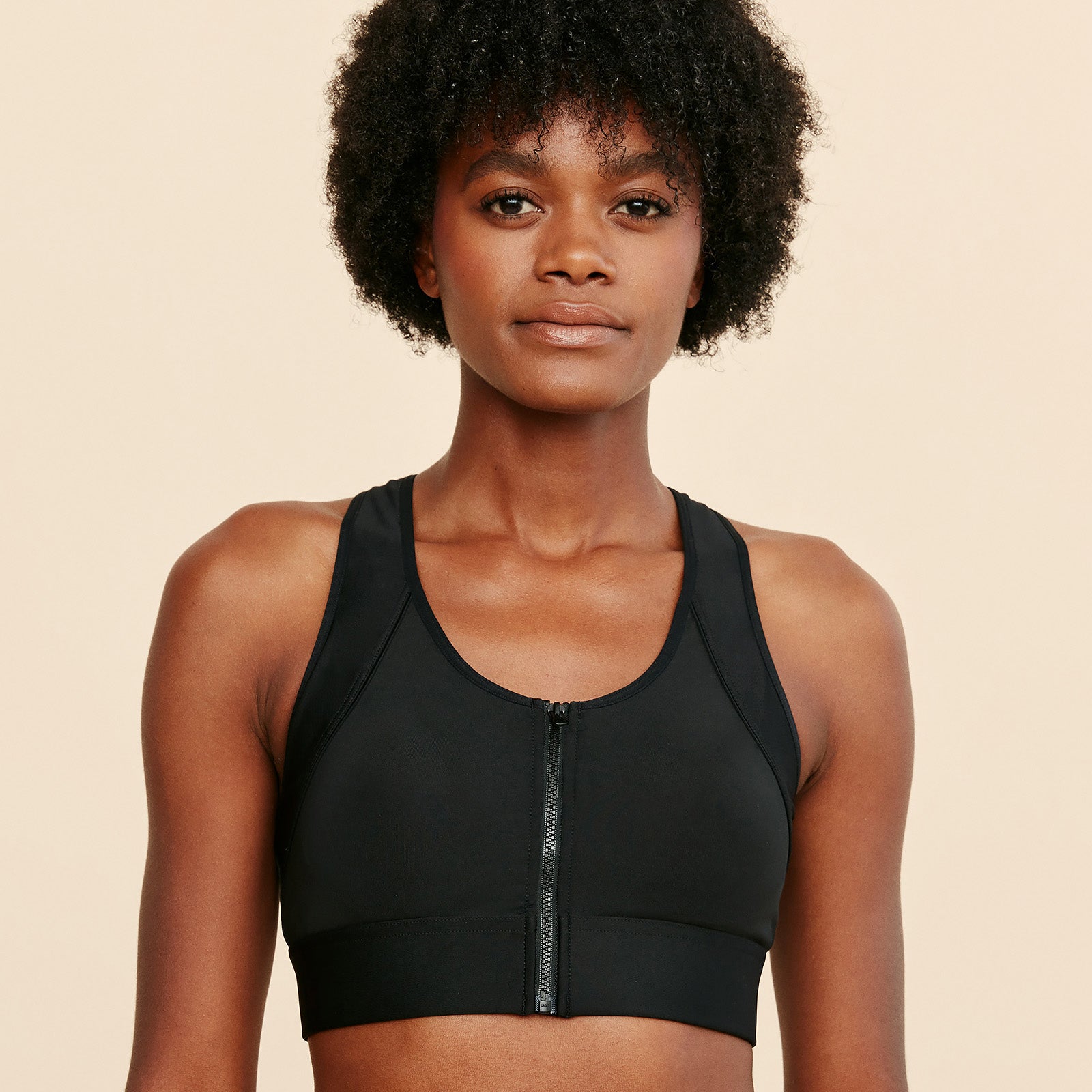 Meadow Hero front-closure sports bra in black, full-length front zip and scoop neck