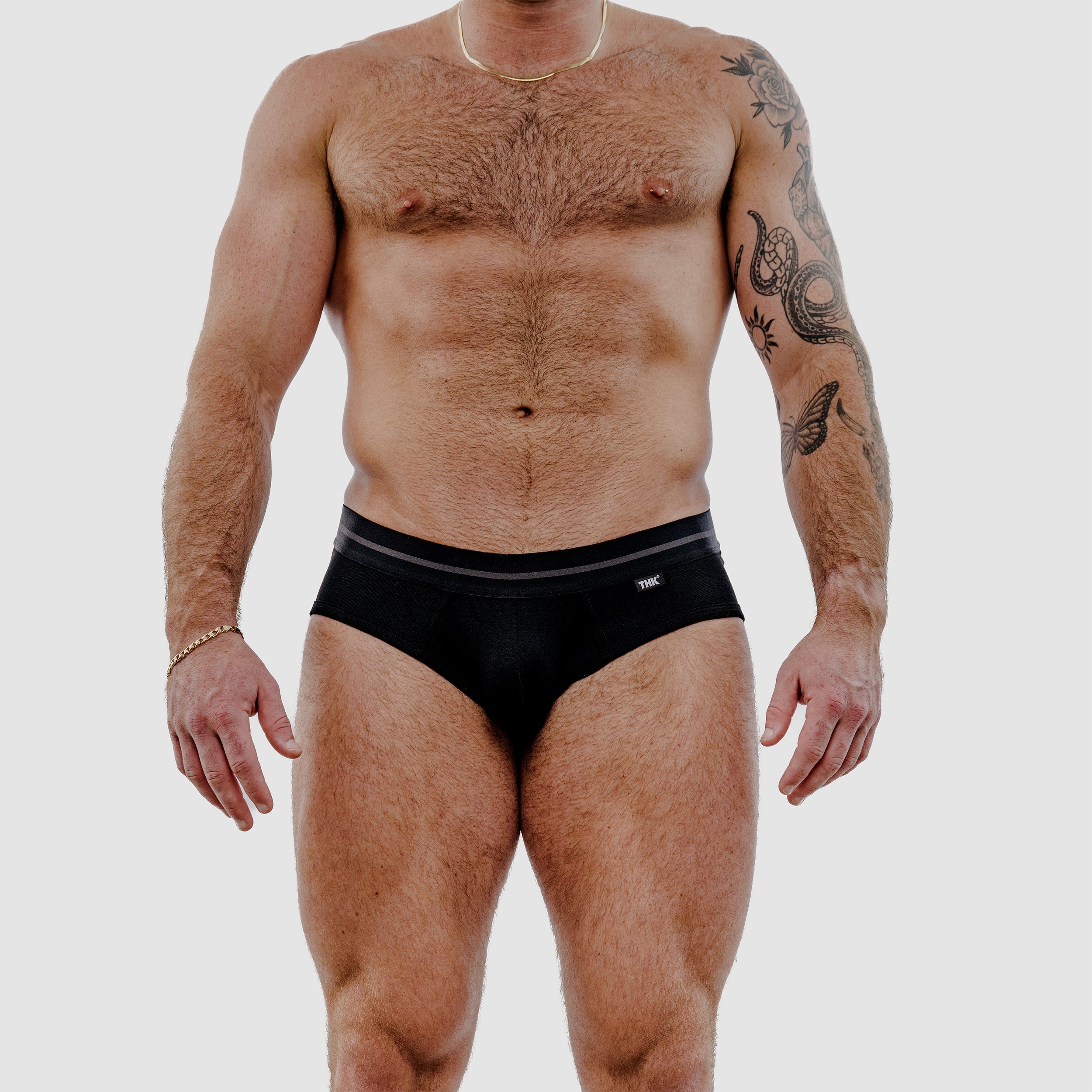 Black standard brief underwear with contrasting gray-striped waistband