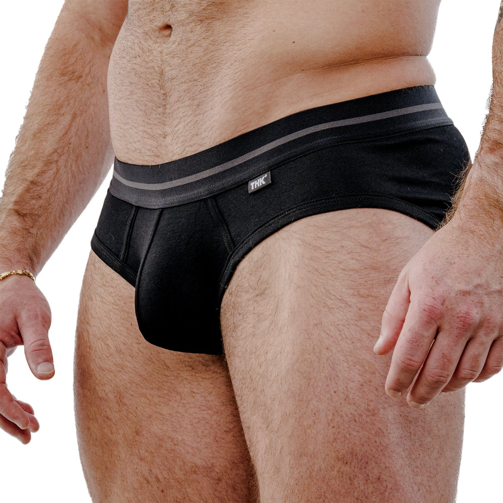 Black brief hip view with gray-striped waistband and small THK logo