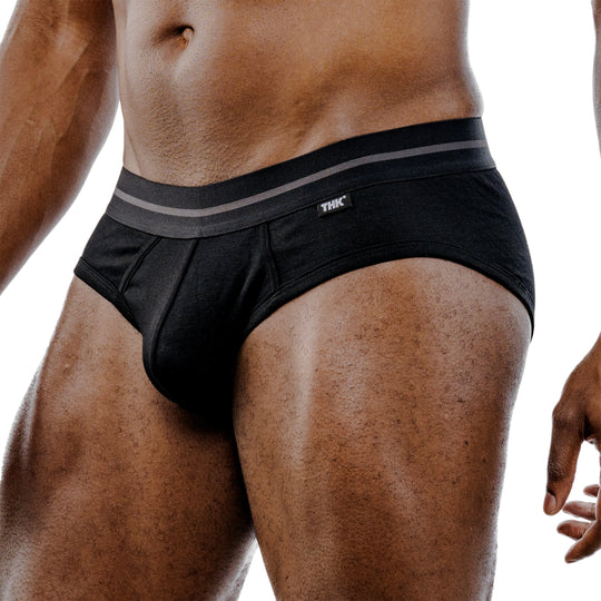 Black brief side view with gray-striped waistband and front panel seams