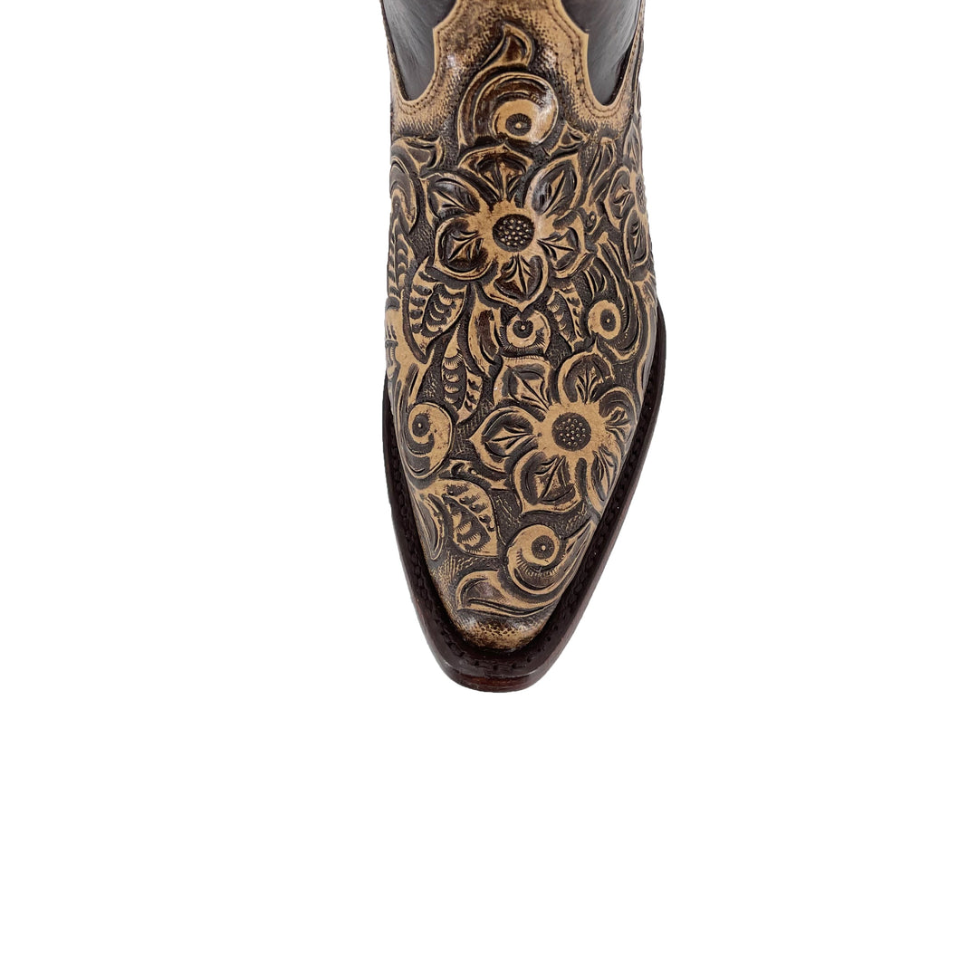 Texan handtooled boots toe close-up, gold floral carving on dark leather