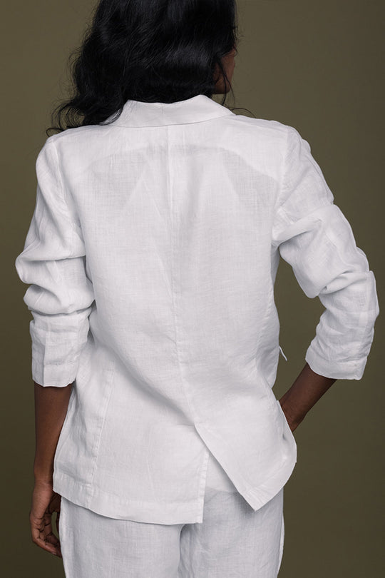 Back view of white three-piece set: button jacket and matching pants