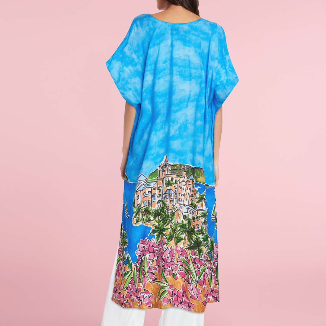 Back view of blue kimono jacket with scenic town and pink floral print, open drape
