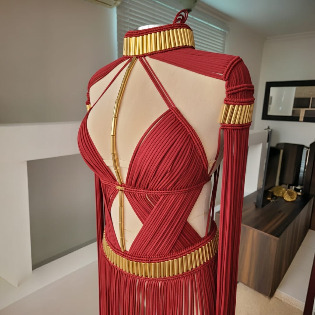 Grecian Elegance Calypso dress back view in deep red with gold trim and drape straps