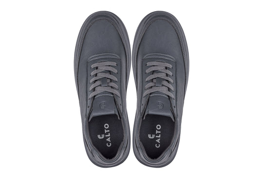 Pair of iron grey sneakers with gray laces and CALTO branding on inner tongue