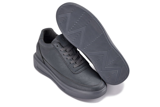 Iron grey sneakers with visible tread outsole and lace-up upper