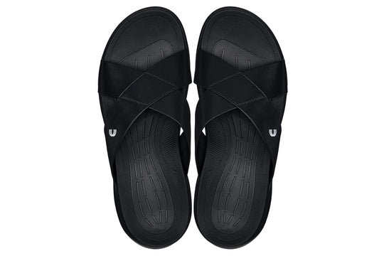 Black matte slide sandals showing both textured outsoles and cushioned insoles.