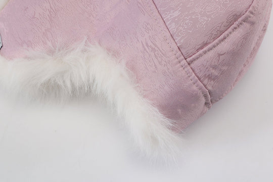 Reversible fur trapper hat, pink outer with white faux-fur trim on cuff