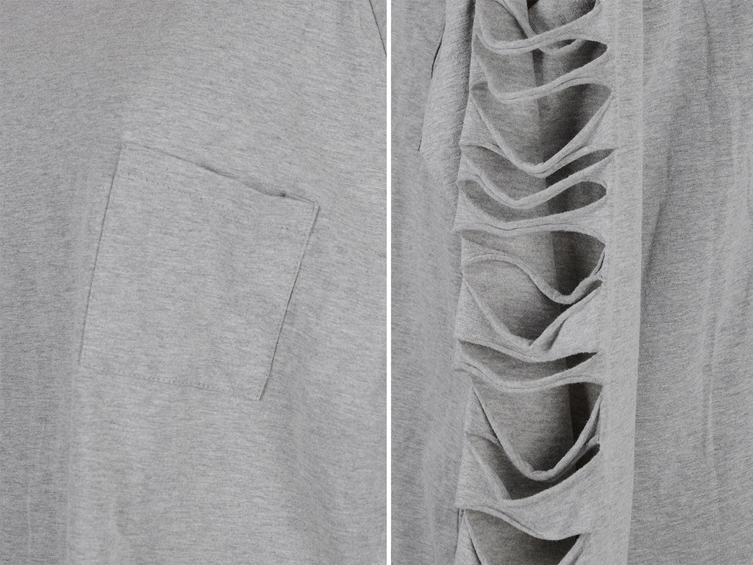 Close-up of light gray pullover fabric and side seam with ripped detailing