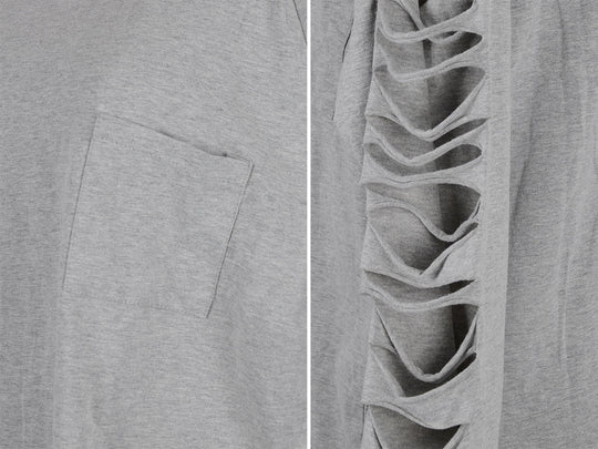 Close-up of light gray pullover fabric and side seam with ripped detailing