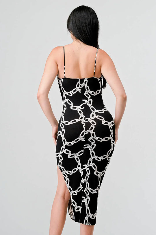 Back view of chain-print midi dress with skinny straps, black with white links