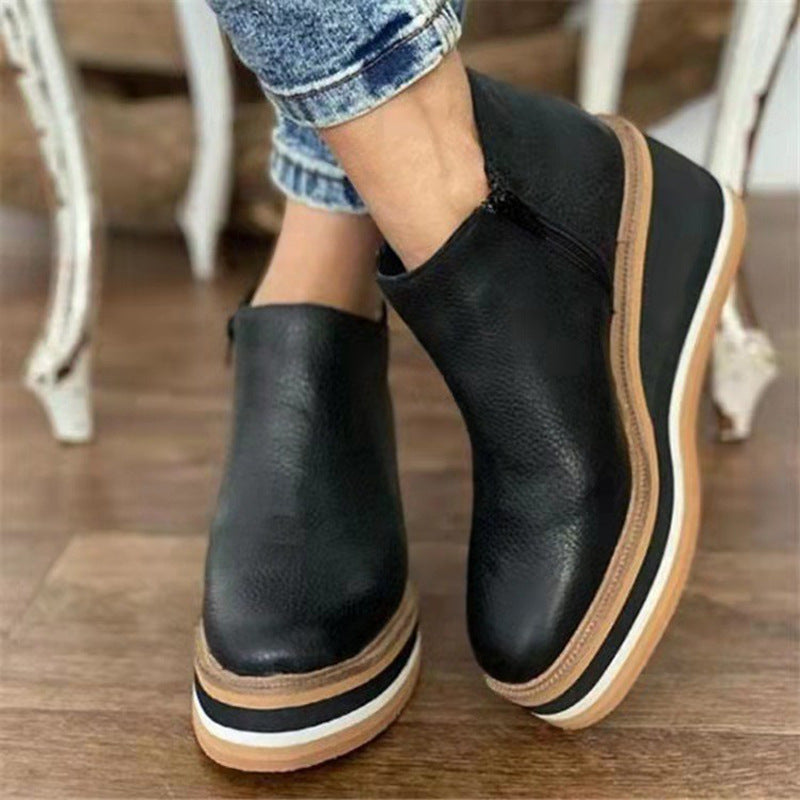 Black platform Chelsea boots with high stacked heel and elastic side panels
