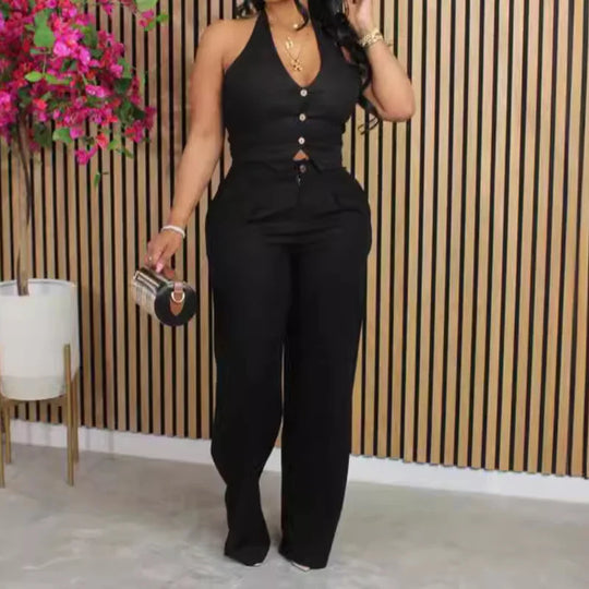 Black two-piece tracksuit set: fitted sleeveless top and long pants with elastic cuffs