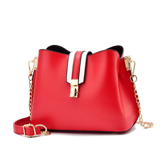 Red bucket bag with white strap detail, gold hardware, and chain crossbody strap
