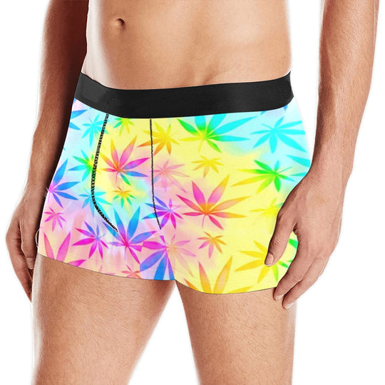 Rainbow weed tie-dye boxer briefs with black waistband, colorful leaf pattern.