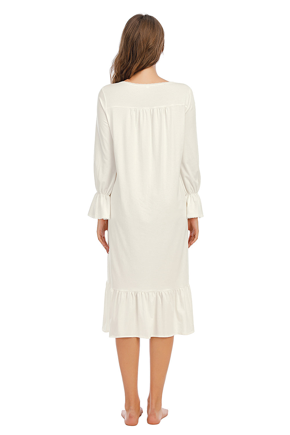 Back view: white nightdress with long gathered sleeves and ruffled hem