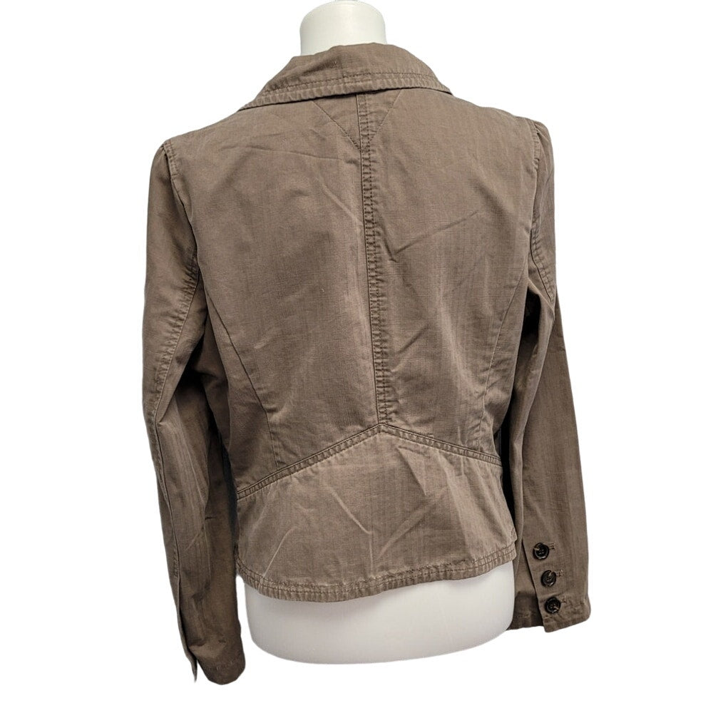 Back view of taupe cotton jacket with stand collar and button detail