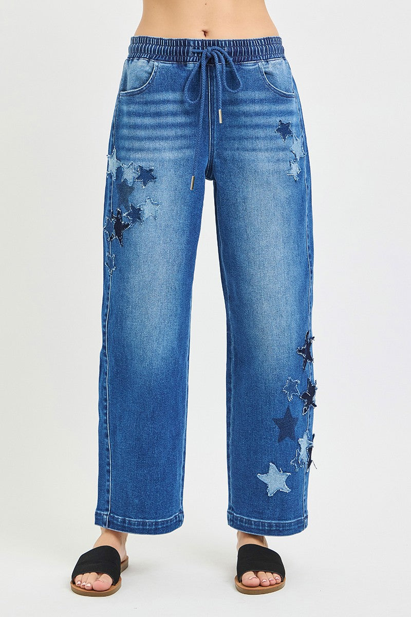 Elastic-waist slouchy cropped barrel jeans in dark denim, star patches on legs