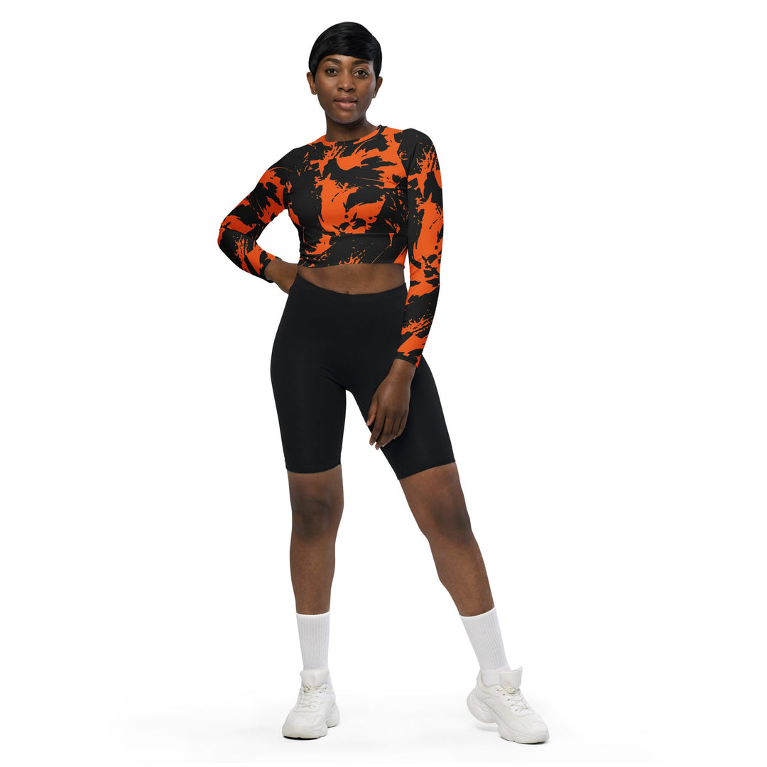 Black and orange fitted long-sleeve crop top with spooky paint splatter graffiti print