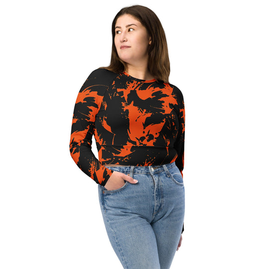 Orange-and-black paint splatter fitted long-sleeve crop top, crew neckline