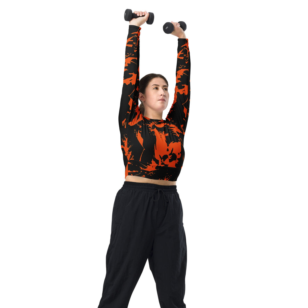 Black long-sleeve fitted crop top with orange spooky paint-splatter design