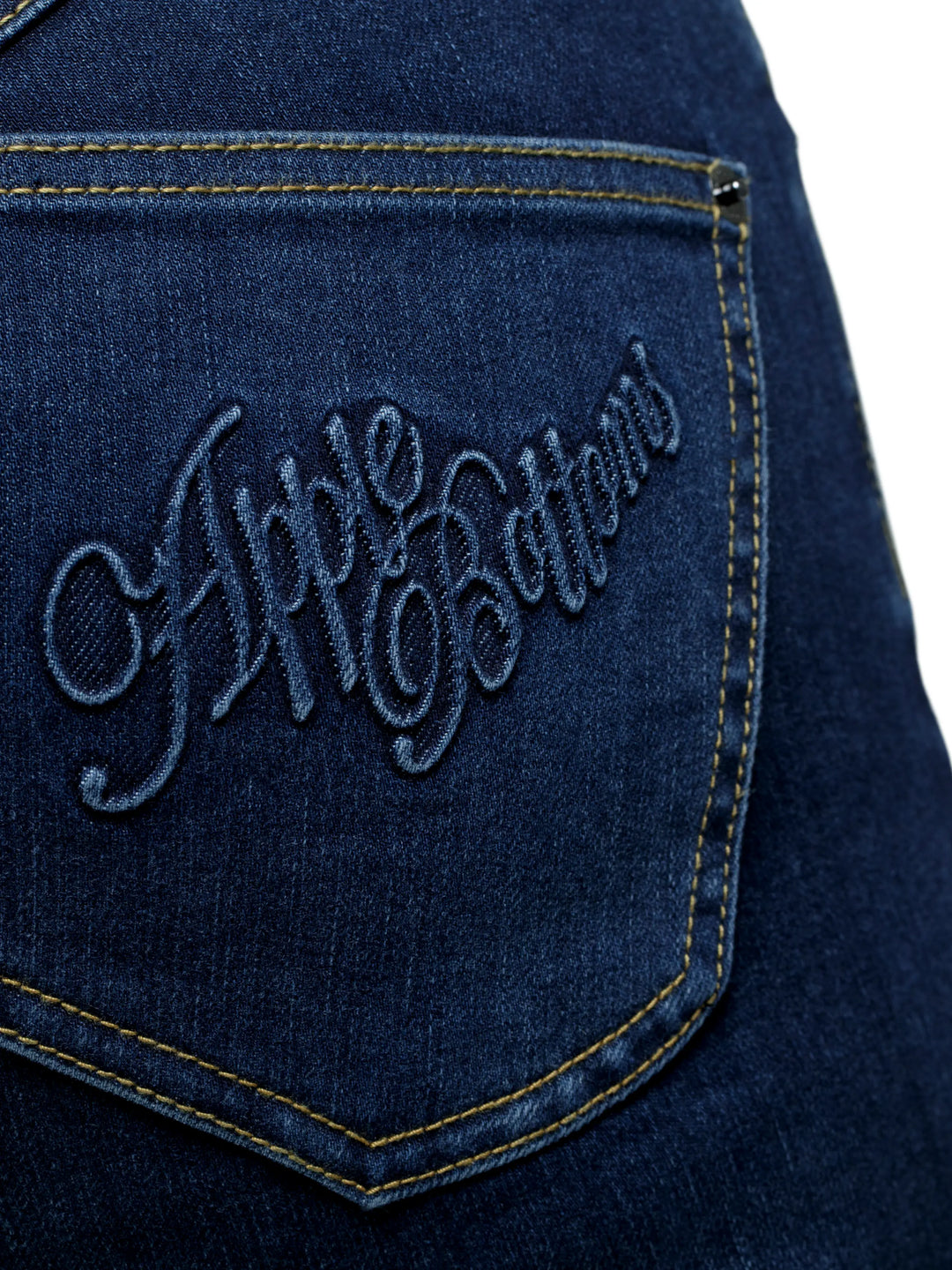 Dark blue back pocket with embroidered script logo and yellow seam stitching