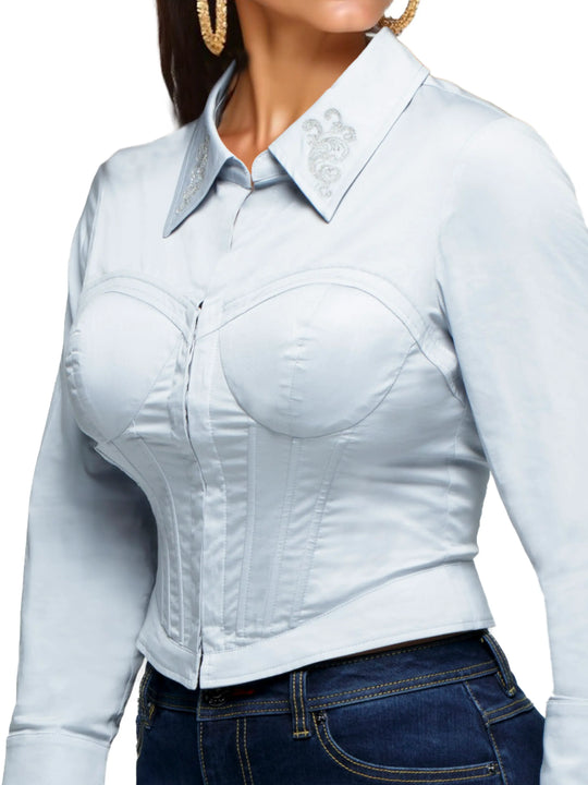 Sky blue corset shirt close-up: embroidered collar, structured bust, long sleeves