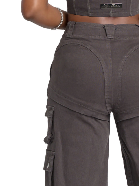 Low-rise twill cargo pants close-up, dark charcoal with stitched seams and pocket flap