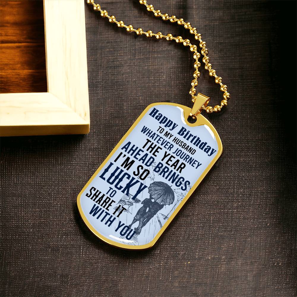Happy Birthday dog tag necklace on a gold chain with “Happy Birthday” front