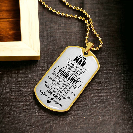 Gold dog tag necklace with engraved pendant and heart detail
