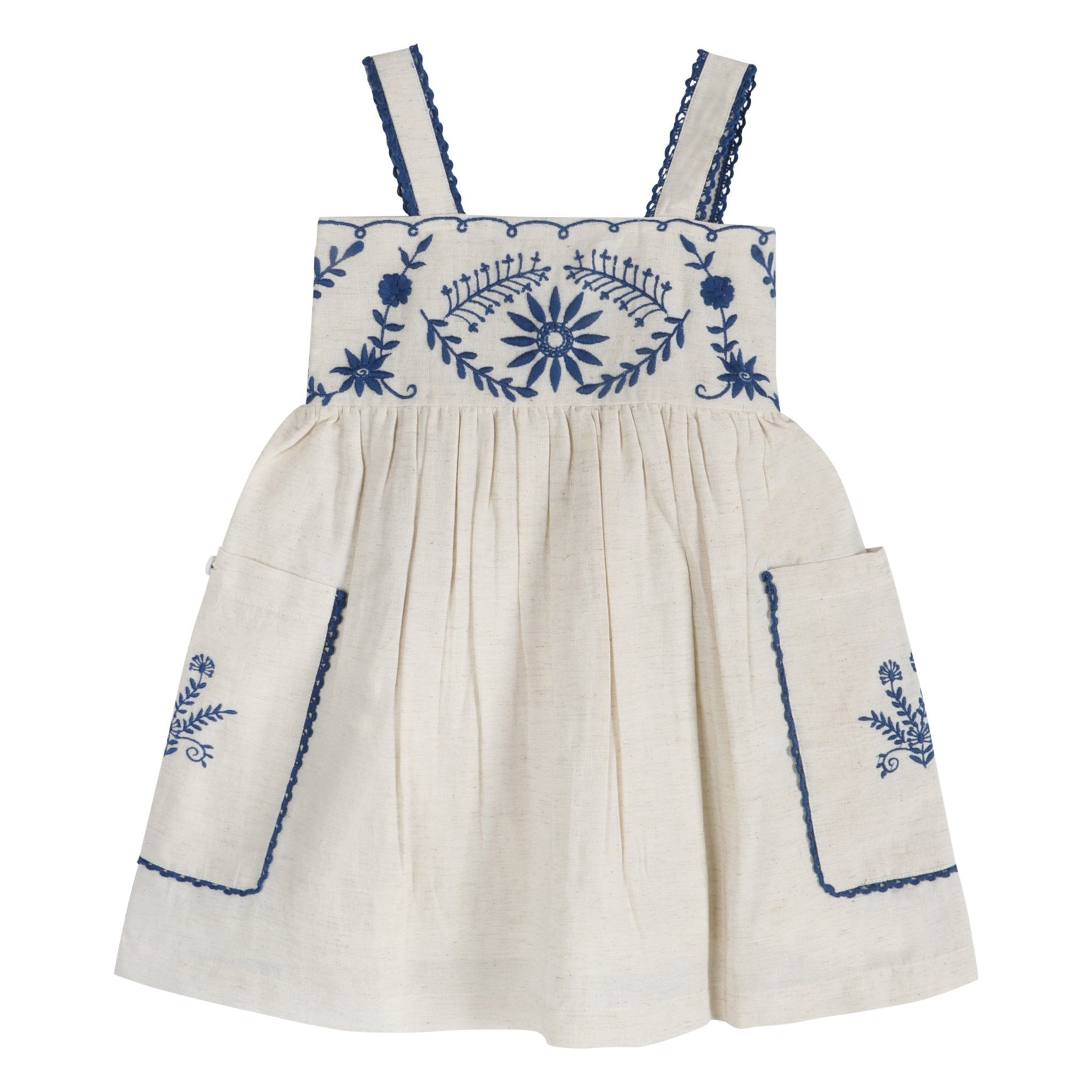 Linen dress with blue hand-embroidered floral yoke, smocked bodice, and wide straps