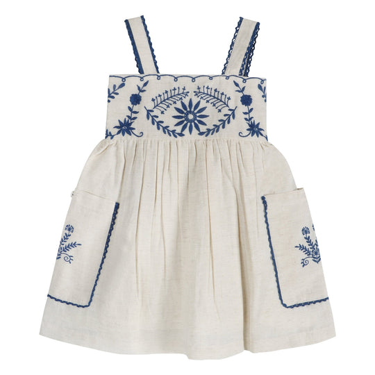 Linen dress with blue hand-embroidered floral yoke, smocked bodice, and wide straps