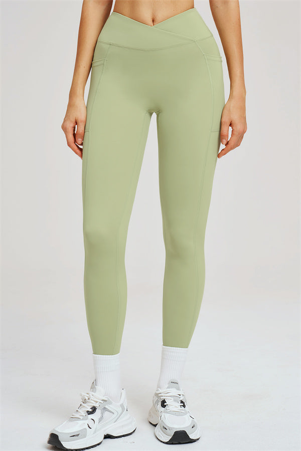 Light olive green high-waist leggings with center seam and tapered leg
