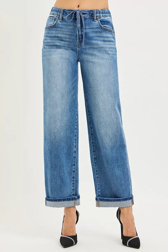 Medium wash slouchy boyfriend jeans, elastic drawstring waist, straight roomy leg