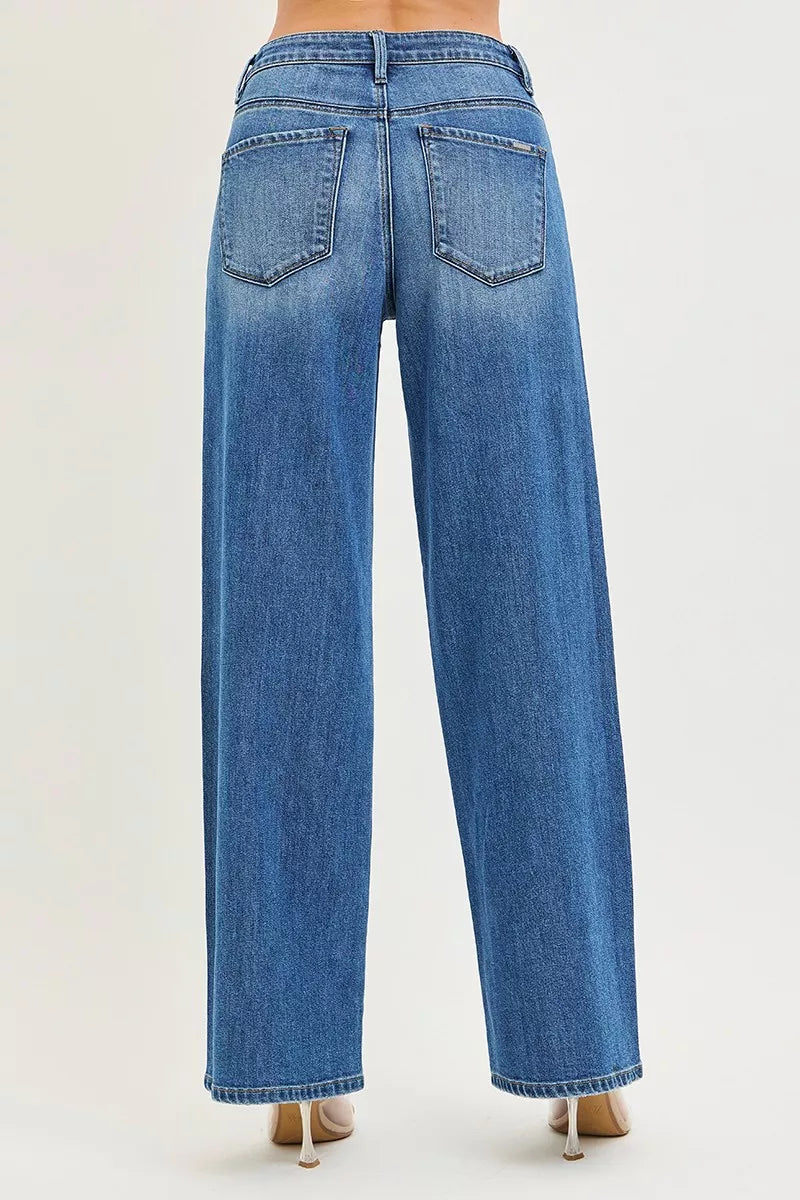 Medium-wash back view baggy jeans with two patch pockets and center seam