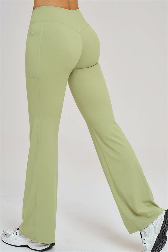 Olive green flared leggings with seam detailing and wide waistband