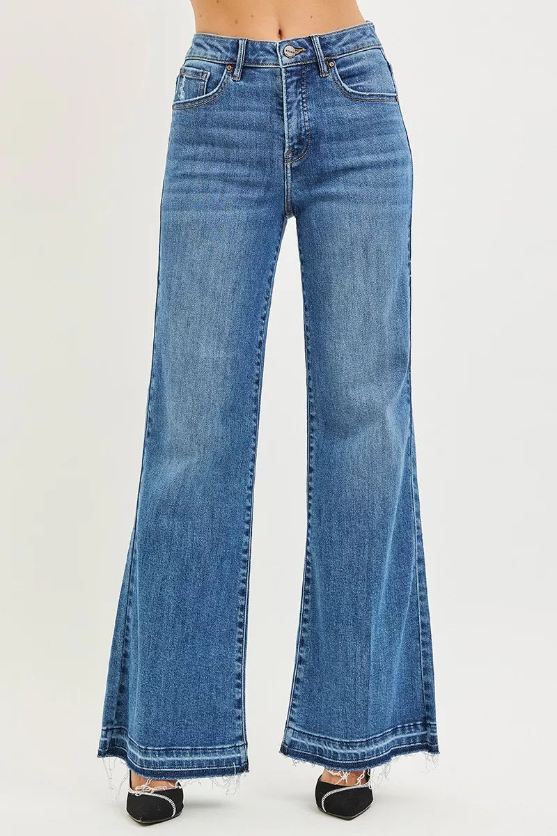 Medium wash high-rise wide-leg jeans with straight legs and frayed hem