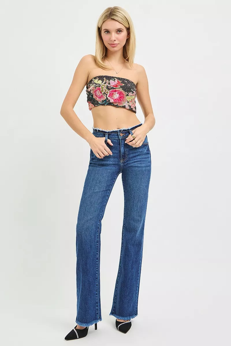 Dark blue mid-rise bootcut jeans with frayed ankle hem detail